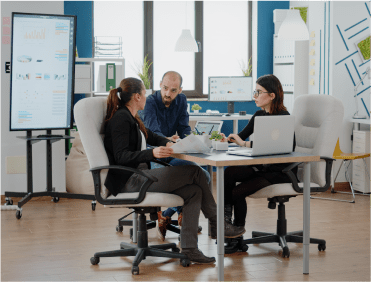 Team of workers collaborating in a bright office spave